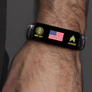 Man wearing a personalized military veteran bracelet with American flag, Army emblem and rank chevron on his wrist