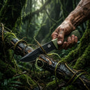 Close-up photo of a survivalist's dirty hands using a green tactical knife to cut a branch with vines in the dense rainforest.