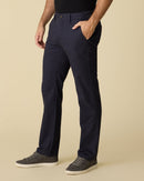 Man wearing Castleton straight-leg chinos with one hand in a pocket
