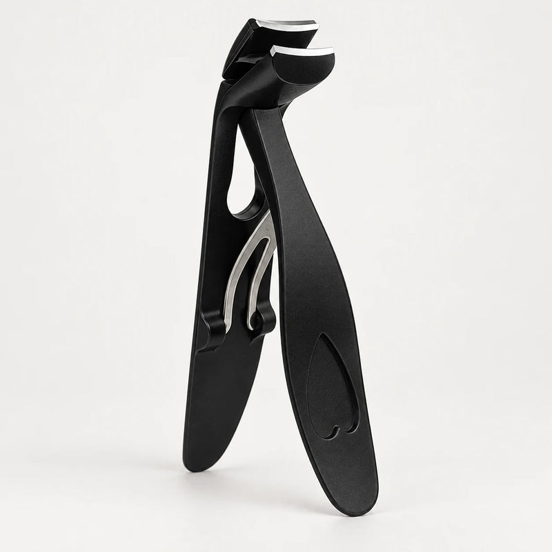 Angled nail clipper with its handle and spring mechanism visible.