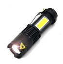 Angled view of the Mini Titanium Laser flashlight with side panel and clip
