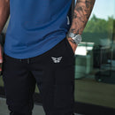 Close-up of black Performance Tech Joggers at the waistband and hip