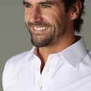 Close-up of the white polo shirt's semi-spread collar and open neckline