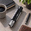 NexTool flashlight resting on a desk