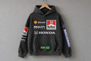 Senna-inspired hoodie hanging from a wooden clothes hanger