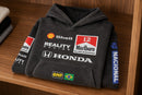 Folded black racing hoodie showing its chest graphics