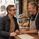 Man wearing SmartVision AI glasses using real-time translation feature at a coffee