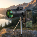 UltraZoom Monocular on tripod capturing wildlife photography in mountain landscape at sunset